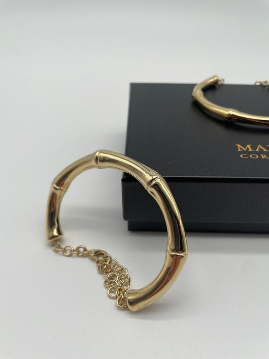 The Bangle Bamboo Bracelet by Marri Cortona, handcrafted in Tuscany, combines lightness, gold elegance, and modern design in timeless Italian style