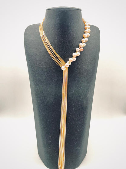 'Asymmetry' necklace of pinkish white pearls
