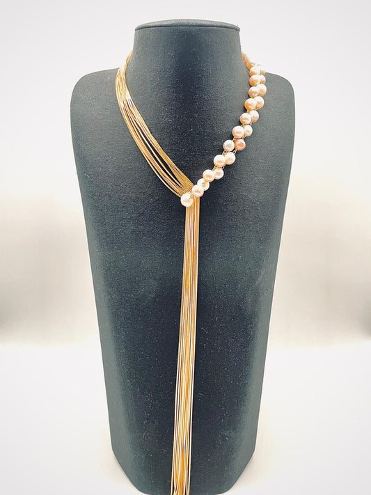 'Asymmetry' necklace of pinkish white pearls