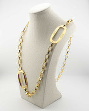 Handcrafted in Tuscany, the MarriCortona Smalto Ellipse Necklace in 18k gold and hand-painted enamel embodies Italian elegance, light, and timeless design.