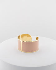 Handcrafted in Tuscany, the MarriCortona Smalto Bracelets in 18k gold and hand-painted enamel feature bold 30 mm bands — radiant, elegant, and uniquely Italian.