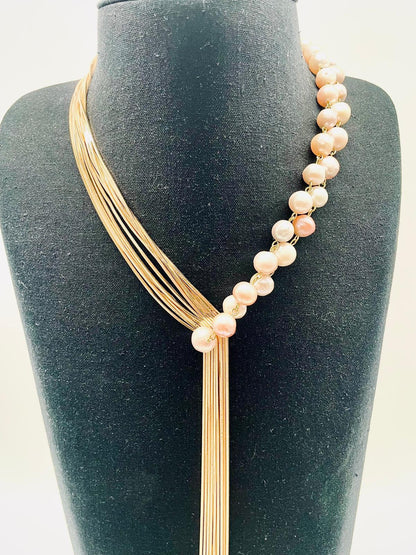 'Asymmetry' necklace of pinkish white pearls