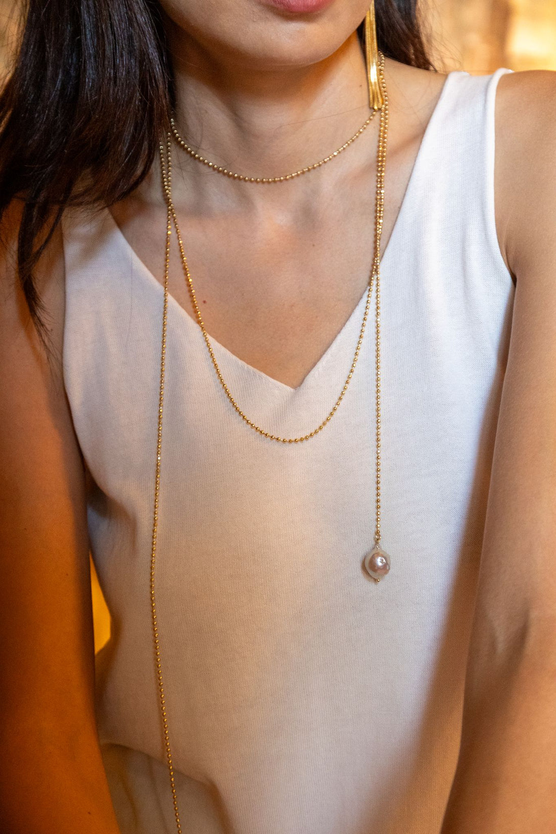 Handcrafted in Tuscany, the Marri Cortona Filo di Luce Necklace features a 2-meter 18k gold chain with natural white pearls for versatile, luminous Italian elegance.