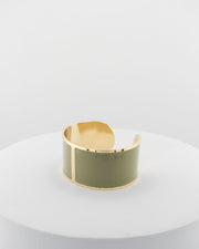 Handcrafted in Tuscany, the MarriCortona Smalto Bracelets in 18k gold and hand-painted enamel feature bold 30 mm bands — radiant, elegant, and uniquely Italian.