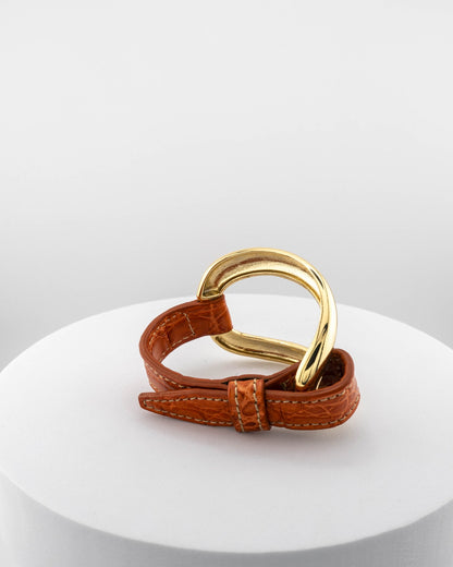 Handcrafted 18K gold-plated bronze bracelet with genuine crocodile leather strap.
An original Marri Cortona design — handmade in Tuscany.
