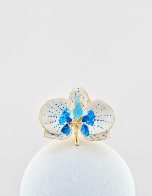 Handcrafted in Tuscany, the Marri Cortona Orchidea Ring in 18k gold bronze captures the orchid’s grace — unique, hand-enameled, and timelessly elegant.