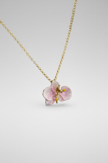 Handcrafted in Tuscany, the Marri Cortona Orchidea Necklace in 18k gold bronze captures the orchid’s grace — elegant, hand-enameled, and timelessly Italian.