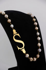 Handcrafted in Tuscany, the Marri Cortona Mia Necklace with freshwater pearls and personalized initial reimagines the classic pearl with modern Italian elegance.