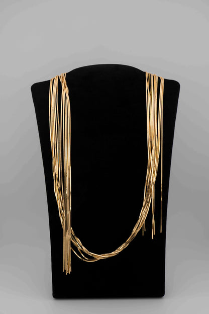 Handcrafted in Tuscany, the MarriCortona Voilà Necklace in bronze18k gold plated features 6 luminous strands — a versatile icon of modern Italian elegance.