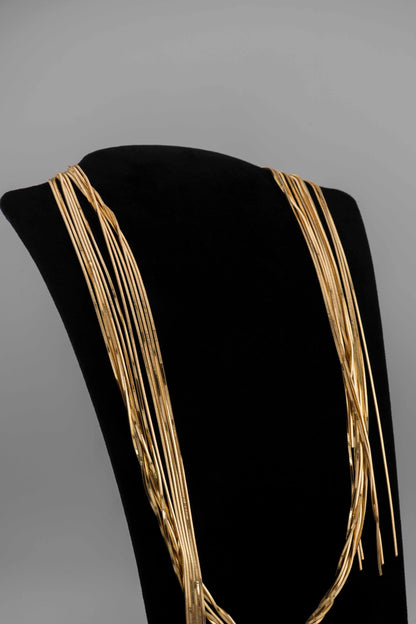 Handcrafted in Tuscany, the MarriCortona Voilà Necklace in bronze18k gold plated features 6 luminous strands — a versatile icon of modern Italian elegance.