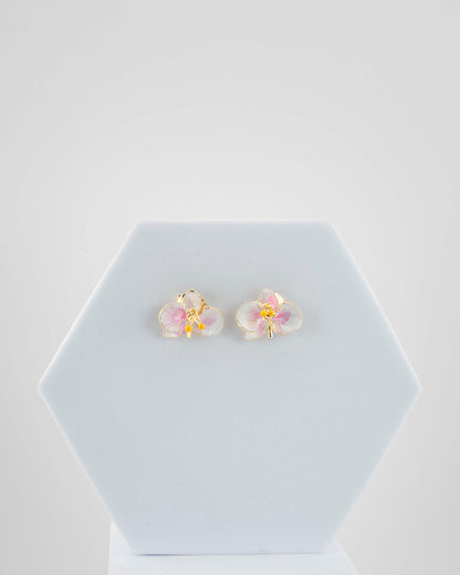 Handcrafted in Tuscany, the Marri Cortona Orchidea Earrings in 18k gold bronze are hand-enameled jewels that blend light, artistry, and timeless elegance.