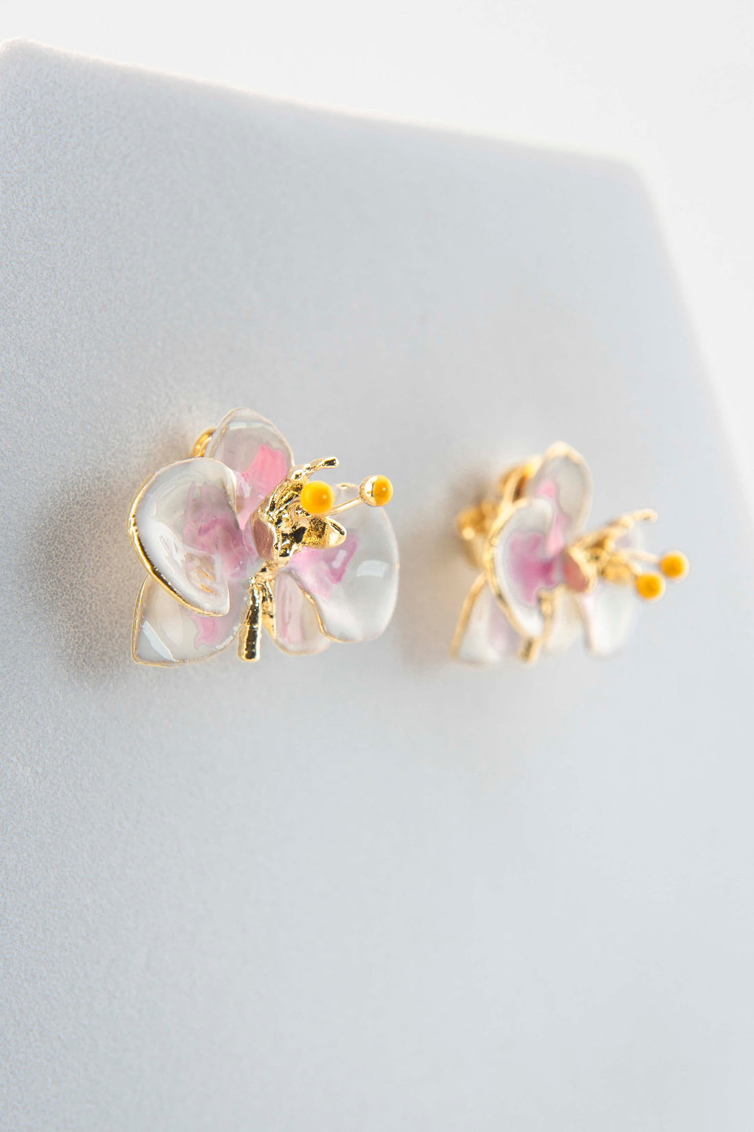 Handcrafted in Tuscany, the Marri Cortona Orchidea Earrings in 18k gold bronze are hand-enameled jewels that blend light, artistry, and timeless elegance.
