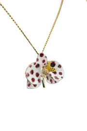 Handcrafted in Tuscany, the Marri Cortona Orchidea Necklace in 18k gold bronze captures the orchid’s grace — elegant, hand-enameled, and timelessly Italian.