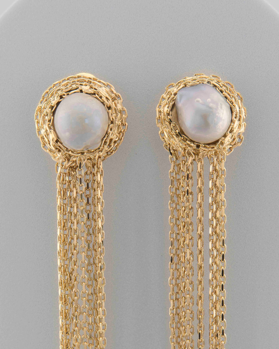 Handcrafted in Tuscany, the Marri Cortona Medusa Earrings blend natural white-grey pearls and 18k gold threads in a luminous, sea-inspired Made in Italy design.