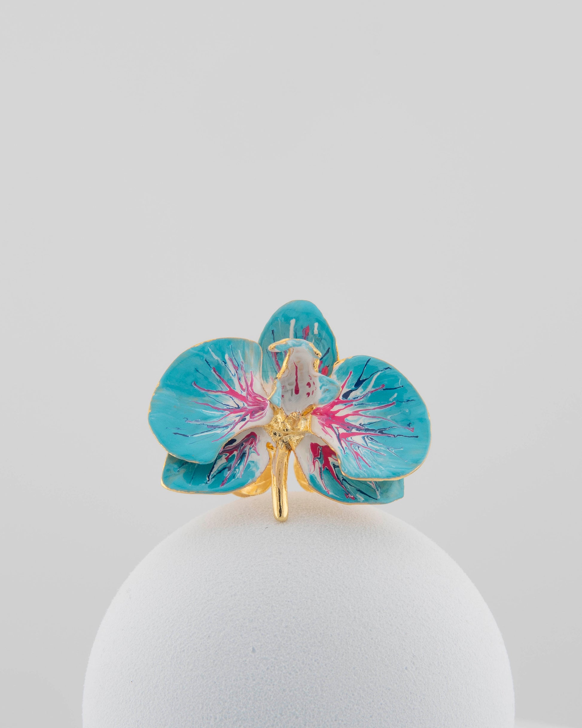 Handcrafted in Tuscany, the Marri Cortona Orchidea Ring in 18k gold bronze captures the orchid’s grace — unique, hand-enameled, and timelessly elegant.