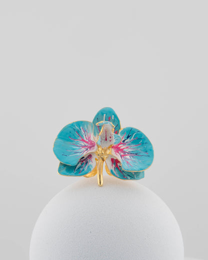 Handcrafted in Tuscany, the Marri Cortona Orchidea Ring in 18k gold bronze captures the orchid’s grace — unique, hand-enameled, and timelessly elegant.