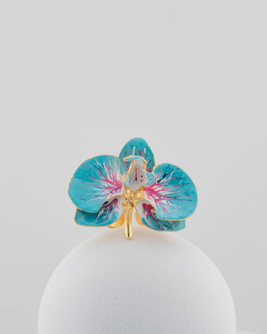 Handcrafted in Tuscany, the Marri Cortona Orchidea Ring in 18k gold bronze captures the orchid’s grace — unique, hand-enameled, and timelessly elegant.