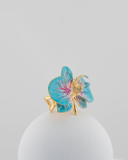 Handcrafted in Tuscany, the Marri Cortona Orchidea Ring in 18k gold bronze captures the orchid’s grace — unique, hand-enameled, and timelessly elegant.