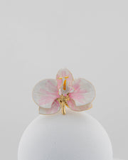 Handcrafted in Tuscany, the Marri Cortona Orchidea Ring in 18k gold bronze captures the orchid’s grace — unique, hand-enameled, and timelessly elegant.