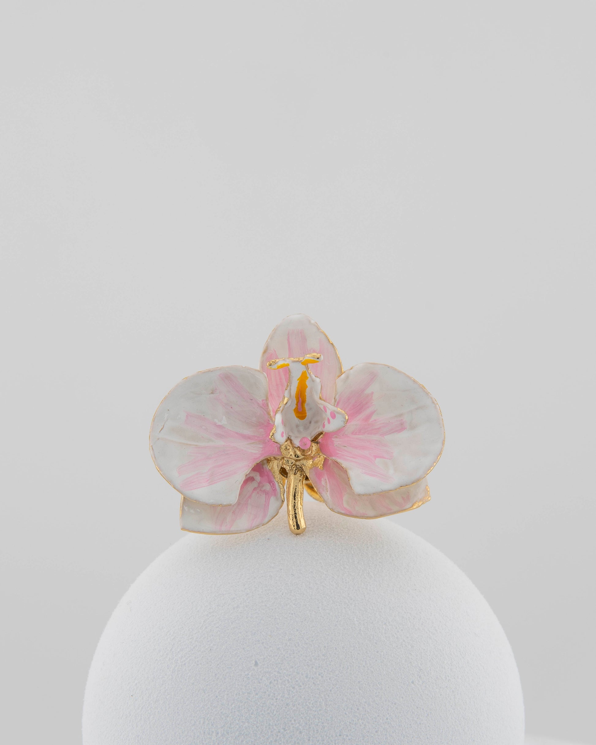 Handcrafted in Tuscany, the Marri Cortona Orchidea Ring in 18k gold bronze captures the orchid’s grace — unique, hand-enameled, and timelessly elegant.