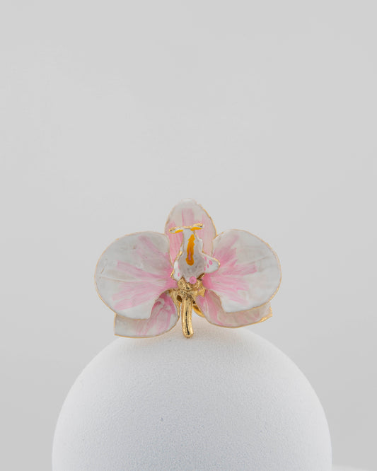 Handcrafted in Tuscany, the Marri Cortona Orchidea Ring in 18k gold bronze captures the orchid’s grace — unique, hand-enameled, and timelessly elegant.