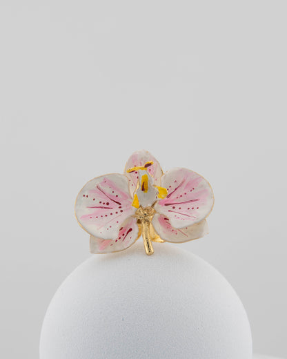 Handcrafted in Tuscany, the Marri Cortona Orchidea Ring in 18k gold bronze captures the orchid’s grace — unique, hand-enameled, and timelessly elegant.