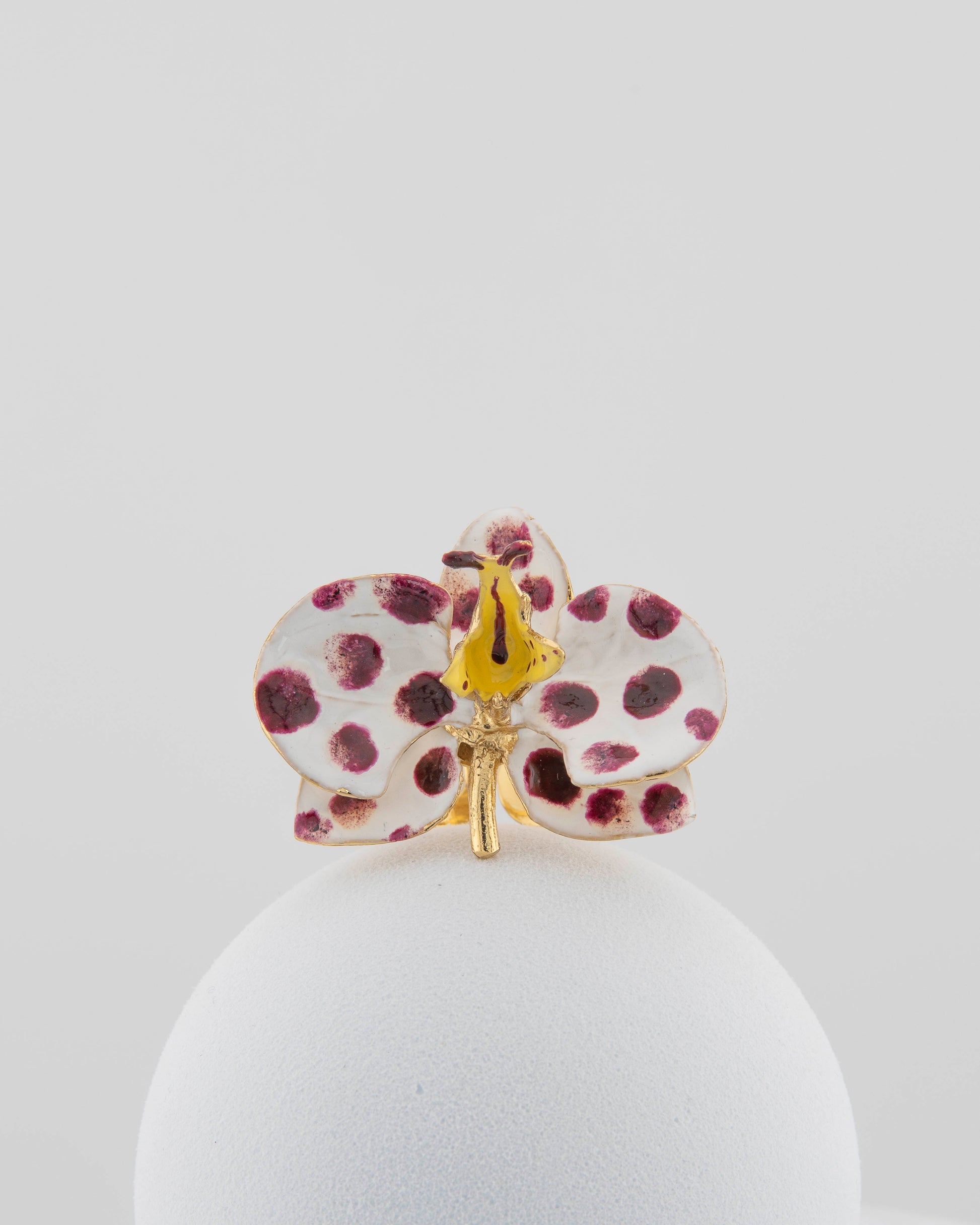 Handcrafted in Tuscany, the Marri Cortona Orchidea Ring in 18k gold bronze captures the orchid’s grace — unique, hand-enameled, and timelessly elegant.