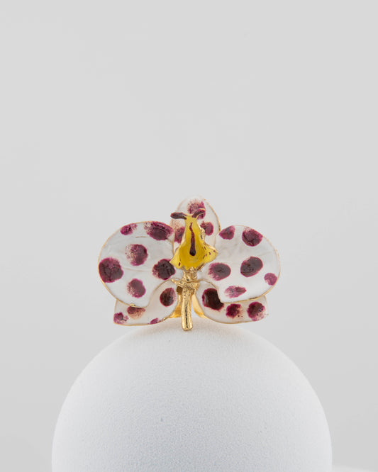 Handcrafted in Tuscany, the Marri Cortona Orchidea Ring in 18k gold bronze captures the orchid’s grace — unique, hand-enameled, and timelessly elegant.