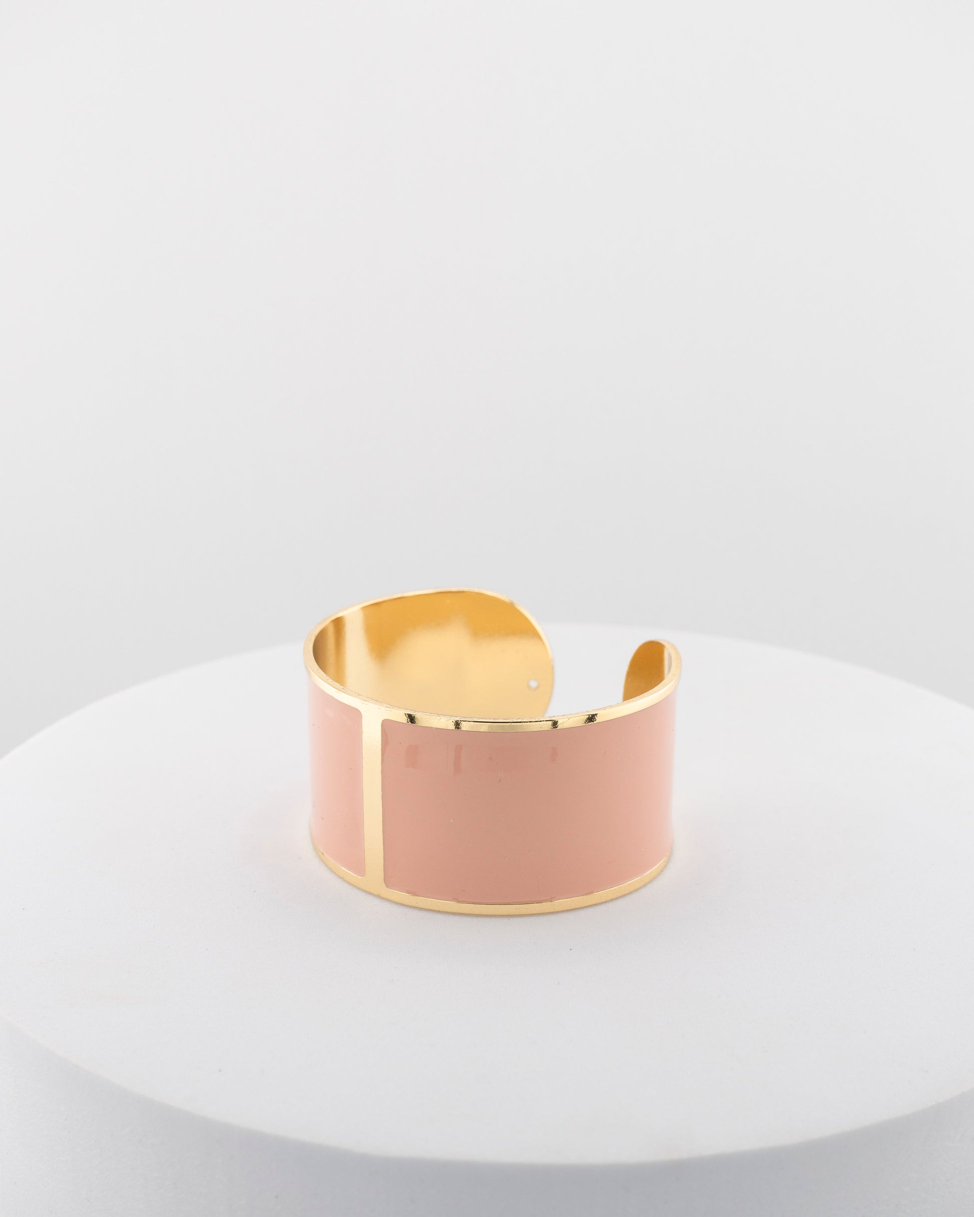 Handcrafted in Tuscany, the MarriCortona Smalto Bracelets in 18k gold and hand-painted enamel feature bold 30 mm bands — radiant, elegant, and uniquely Italian.