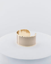 Handcrafted in Tuscany, the MarriCortona Smalto Bracelets in 18k gold and hand-painted enamel feature bold 30 mm bands — radiant, elegant, and uniquely Italian.