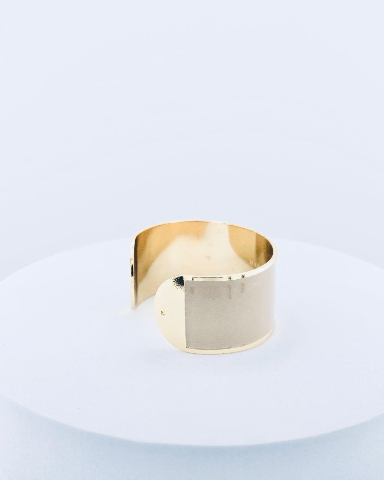 Handcrafted in Tuscany, the MarriCortona Smalto Bracelets in 18k gold and hand-painted enamel feature bold 30 mm bands — radiant, elegant, and uniquely Italian.