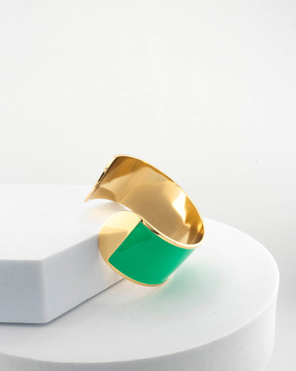 Handcrafted in Tuscany, the MarriCortona Smalto Bracelets in 18k gold and hand-painted enamel feature bold 30 mm bands — radiant, elegant, and uniquely Italian.