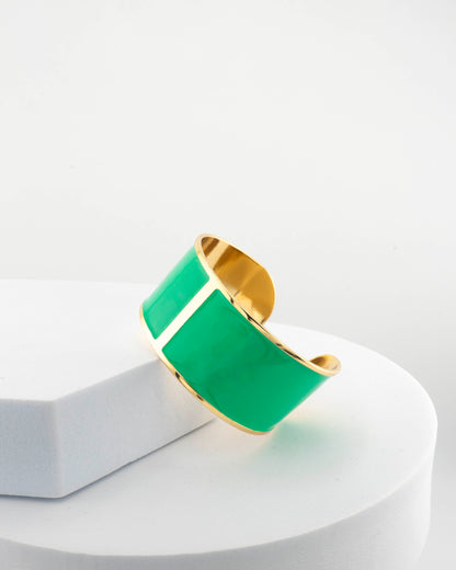 Handcrafted in Tuscany, the MarriCortona Smalto Bracelets in 18k gold and hand-painted enamel feature bold 30 mm bands — radiant, elegant, and uniquely Italian.