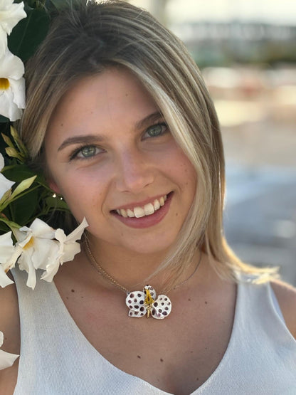 Handcrafted in Tuscany, the Marri Cortona Orchidea Necklace in 18k gold bronze captures the orchid’s grace — elegant, hand-enameled, and timelessly Italian.