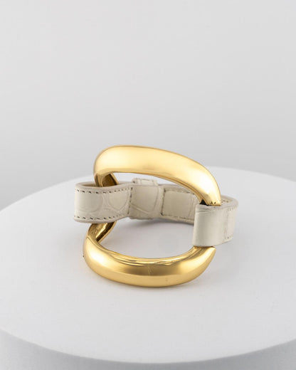 Handcrafted 18K gold-plated bronze bracelet with genuine crocodile leather strap.
An original Marri Cortona design — handmade in Tuscany.