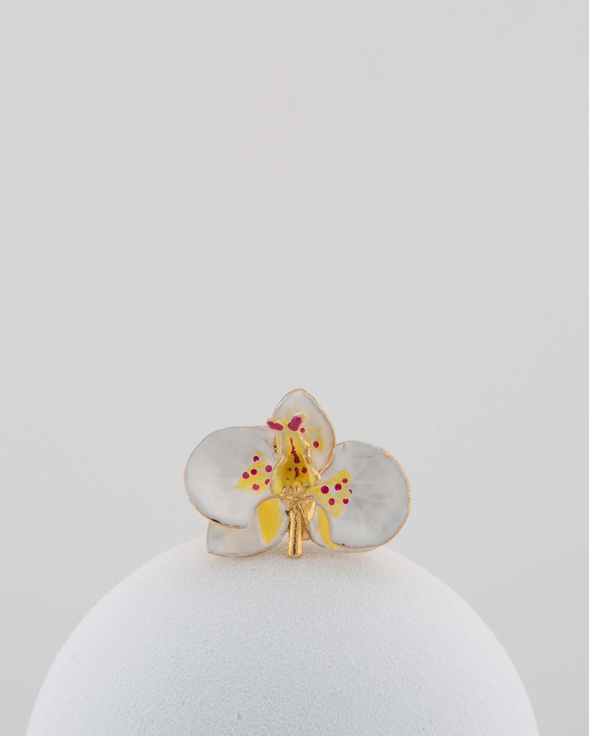 Handcrafted in Tuscany, the Marri Cortona Orchidea Ring in 18k gold bronze captures the orchid’s grace — unique, hand-enameled, and timelessly elegant.