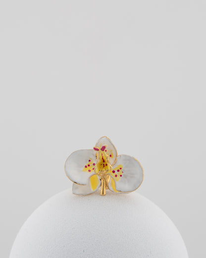 Handcrafted in Tuscany, the Marri Cortona Orchidea Ring in 18k gold bronze captures the orchid’s grace — unique, hand-enameled, and timelessly elegant.