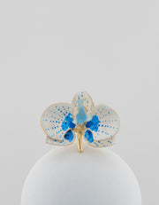 Handcrafted in Tuscany, the Marri Cortona Orchidea Ring in 18k gold bronze captures the orchid’s grace — unique, hand-enameled, and timelessly elegant.