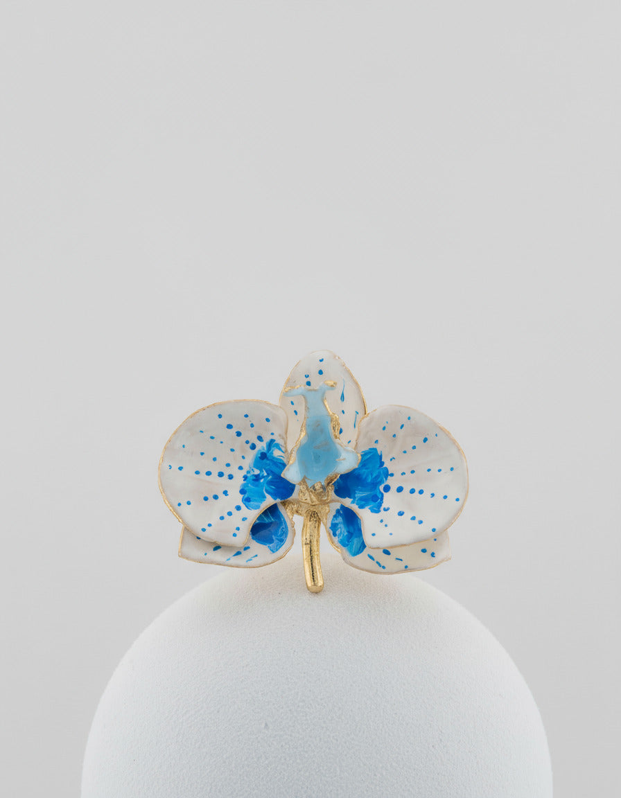 Handcrafted in Tuscany, the Marri Cortona Orchidea Ring in 18k gold bronze captures the orchid’s grace — unique, hand-enameled, and timelessly elegant.