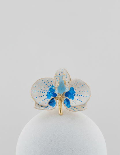 Handcrafted in Tuscany, the Marri Cortona Orchidea Ring in 18k gold bronze captures the orchid’s grace — unique, hand-enameled, and timelessly elegant.