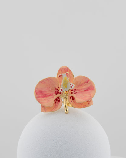 Handcrafted in Tuscany, the Marri Cortona Orchidea Ring in 18k gold bronze captures the orchid’s grace — unique, hand-enameled, and timelessly elegant.