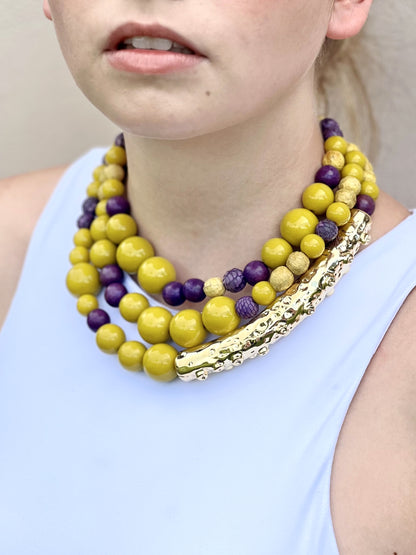 Octopus necklace with elements in genuine python skin, wood and resin