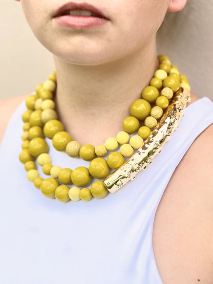 Octopus necklace with elements in genuine python skin, wood and resin